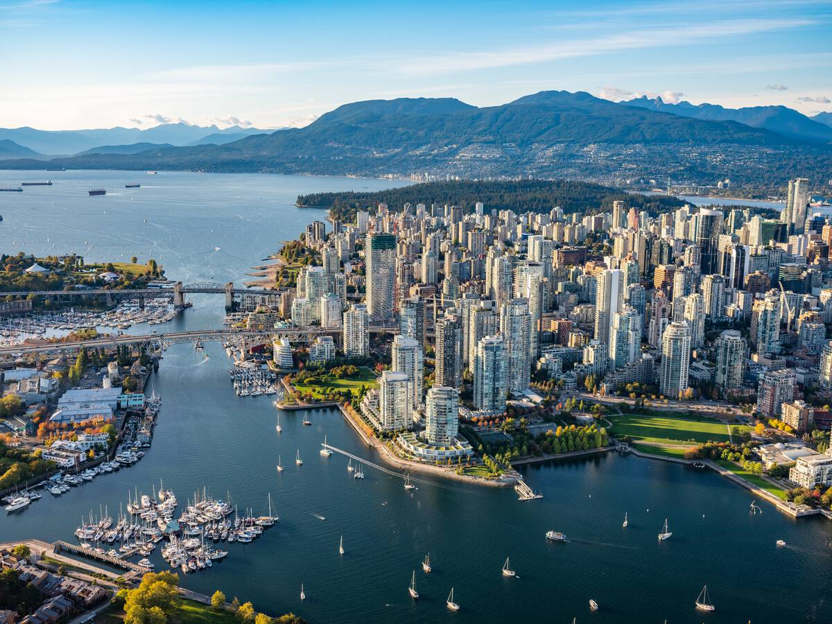 False Creek is in the foreground, then the highrises of downtown Vancouver backed by the Pacific and the North Shore Mountains